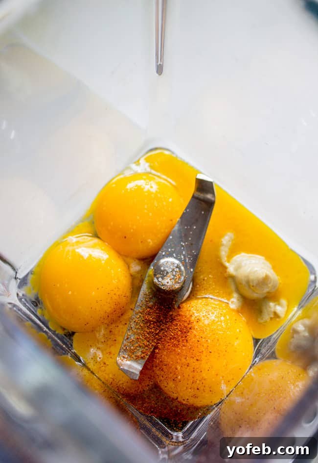 Initial ingredients for Hollandaise sauce in a blender cup before adding butter - The Food Charlatan