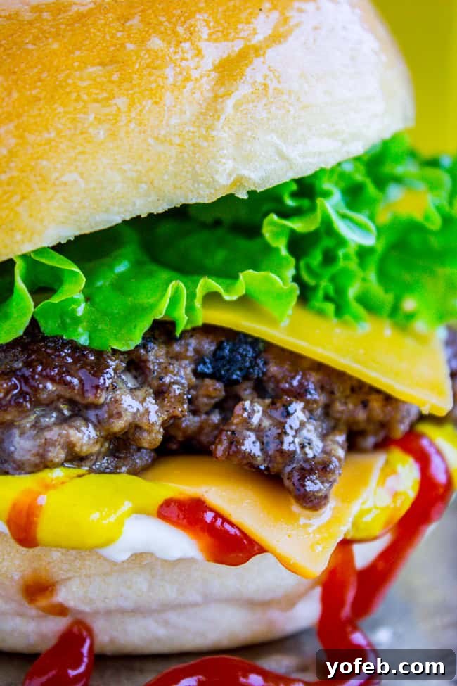 Homemade Smash Burger: Crispy Edges, Juicy Core A tantalizing close-up of a homemade smash burger, showcasing its crispy edges and rich, melted cheese.