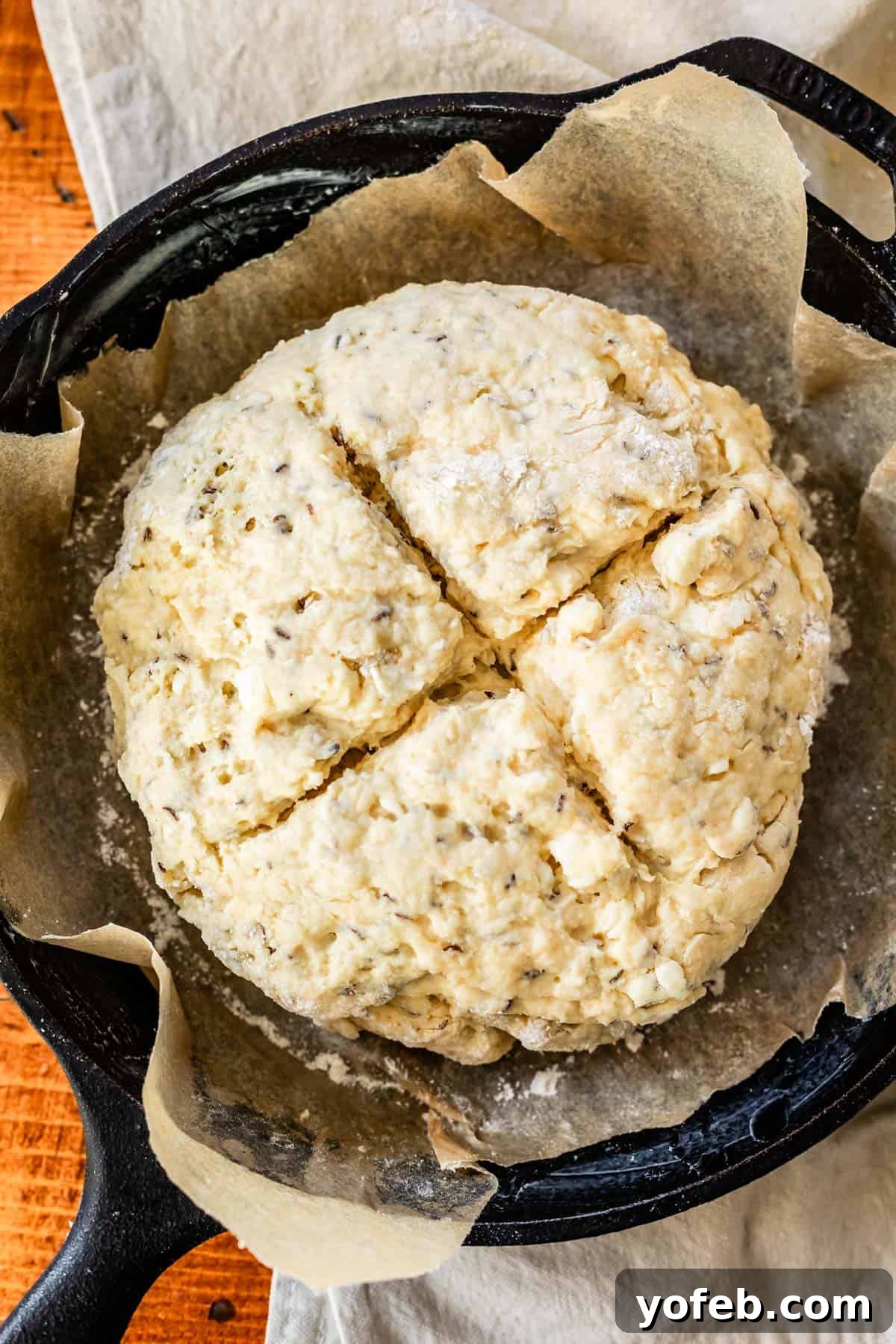 Pure Irish Soda Bread Perfection 15 raw Irish soda bread with an X cut in the top.