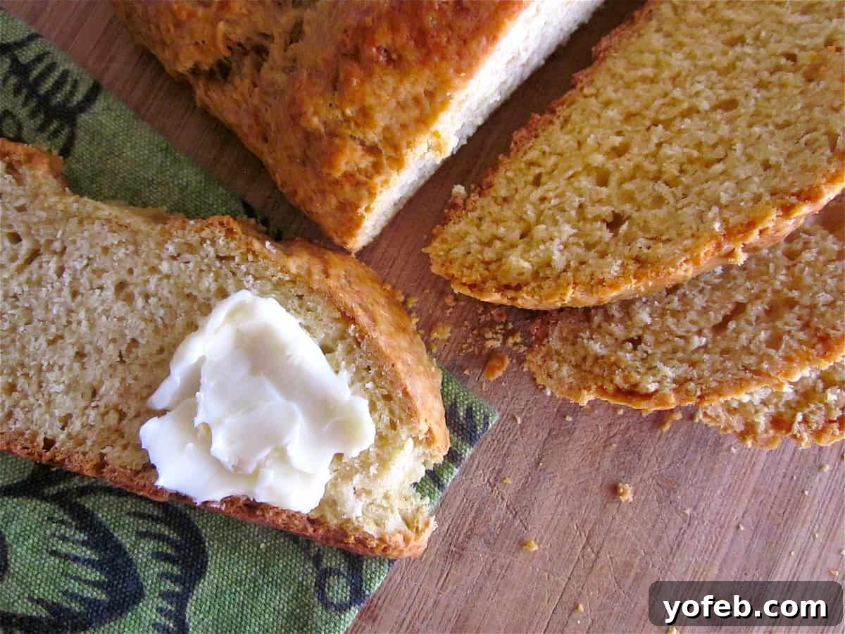 IMG_2485 sliced Irish soda bread with butter spread on a slice.