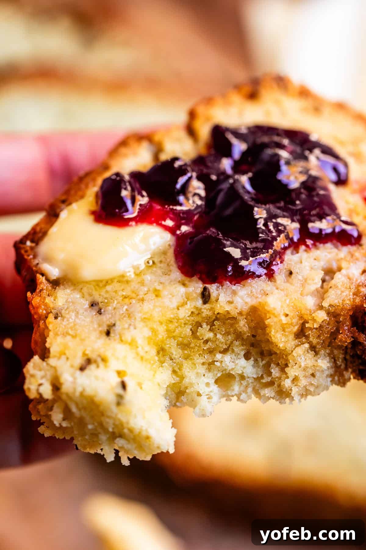Pure Irish Soda Bread Perfection 5 Close up of Irish soda bread with butter and blackberry jam spread on top.