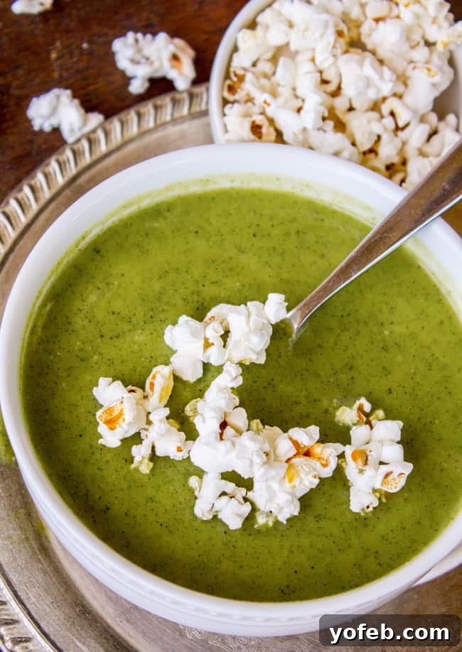 Zucchini Velvet with a Pop of Corn 4 Creamy zucchini soup generously topped with fluffy popcorn.