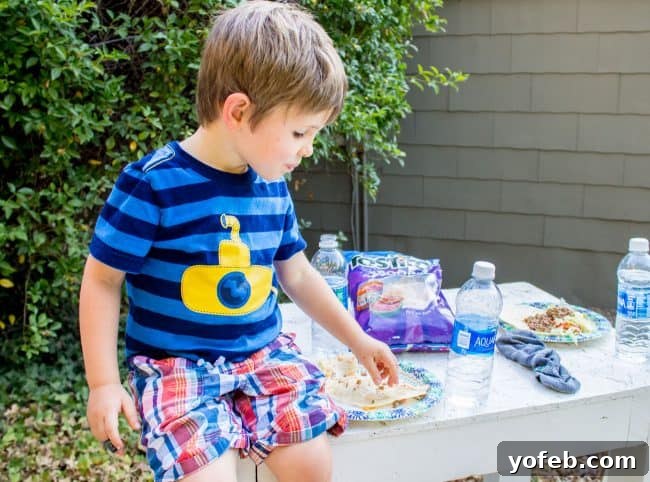 Salsa in 5: Restaurant Flavor for Your Best Taco Tuesday Yet 9 Child eating a taco in the backyard.