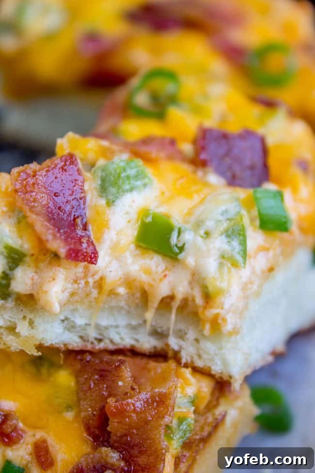 Smoky Bacon Jalapeño Cheesy Pull-Apart Bread 3 Jalapeño Popper Cheesy Bread with Bacon, showing the creamy filling being spread