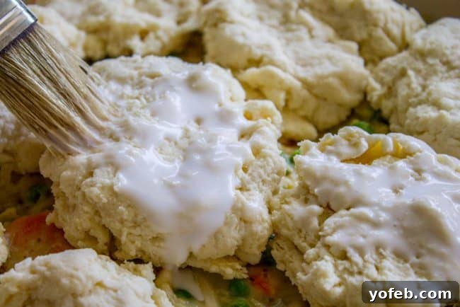 Buttermilk biscuits for chicken pot pie: The perfect flaky topping. Close-up of fluffy buttermilk biscuits ready to be placed on chicken pot pie