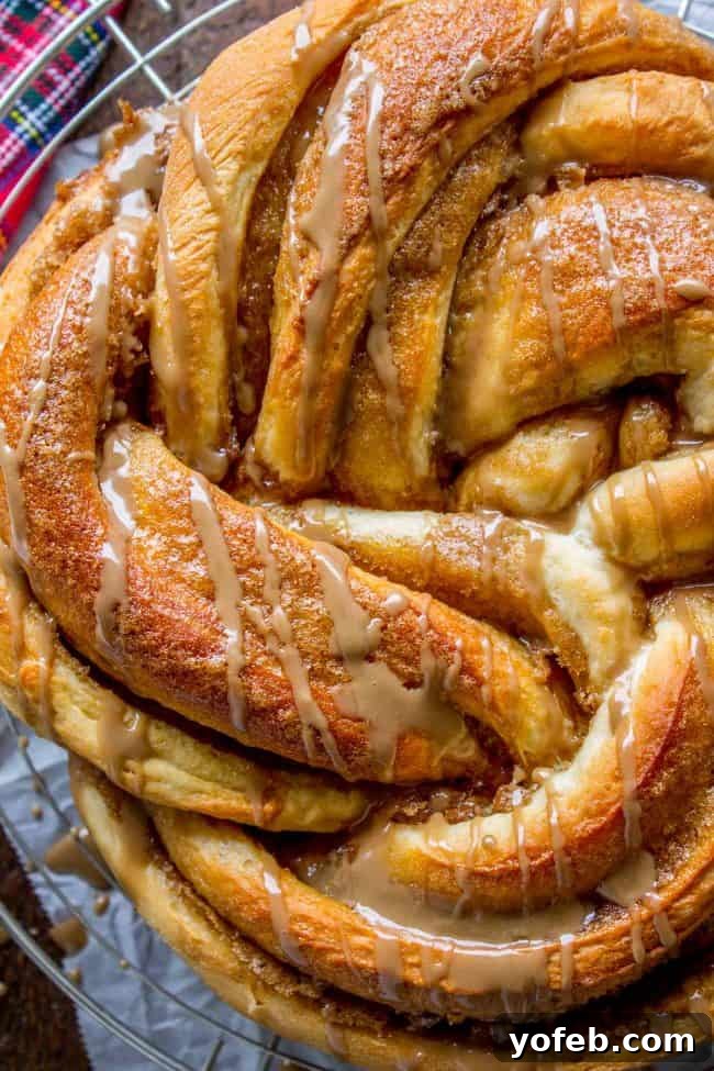 Maple Butter Morning Twist 17 A generous serving of Maple Butter Twist Coffee Cake, showcasing its delightful maple glaze and intricate design.