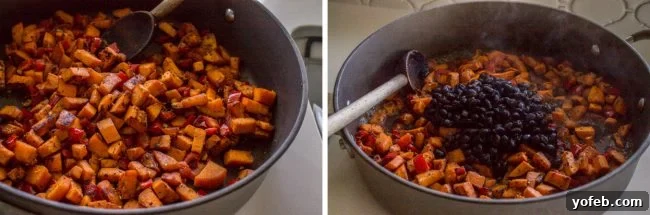 Sweet potatoes and black beans simmering in a skillet with a wooden spoon, forming the hearty enchilada filling.