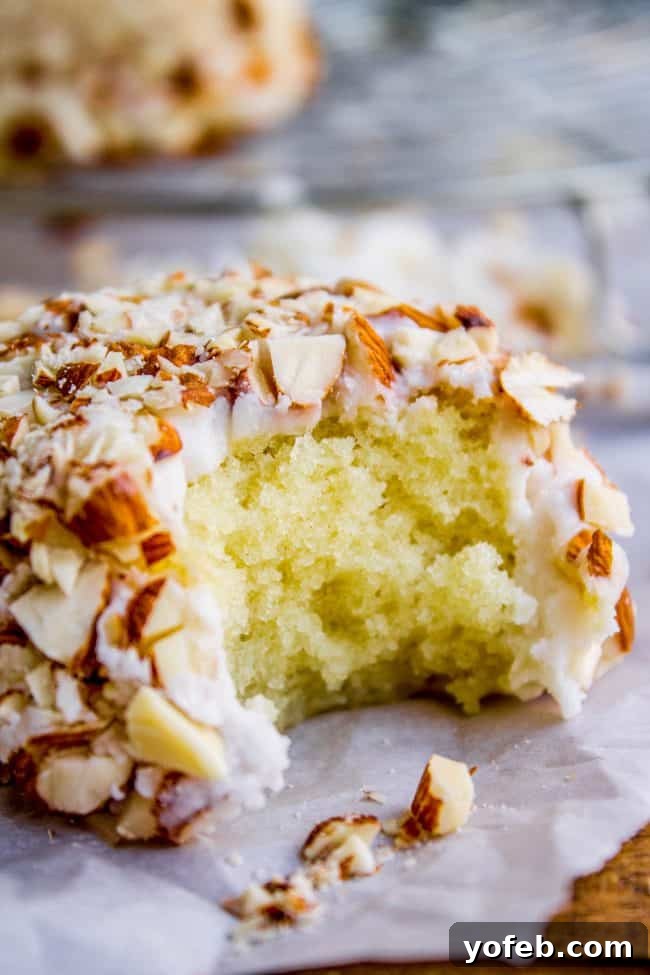 Crispy Almond Upside Down Cupcakes 5 Artfully arranged Upside Down Almond Crunch Cupcakes on a rustic wooden board