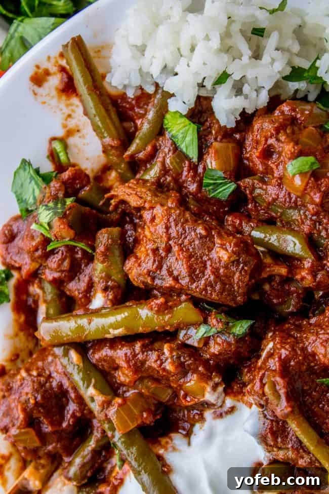 Tender Lebanese Beef and Green Bean Braise 5 Braised Beef and Green Bean Stew (Lebanese Lubee) plated with rice and yogurt