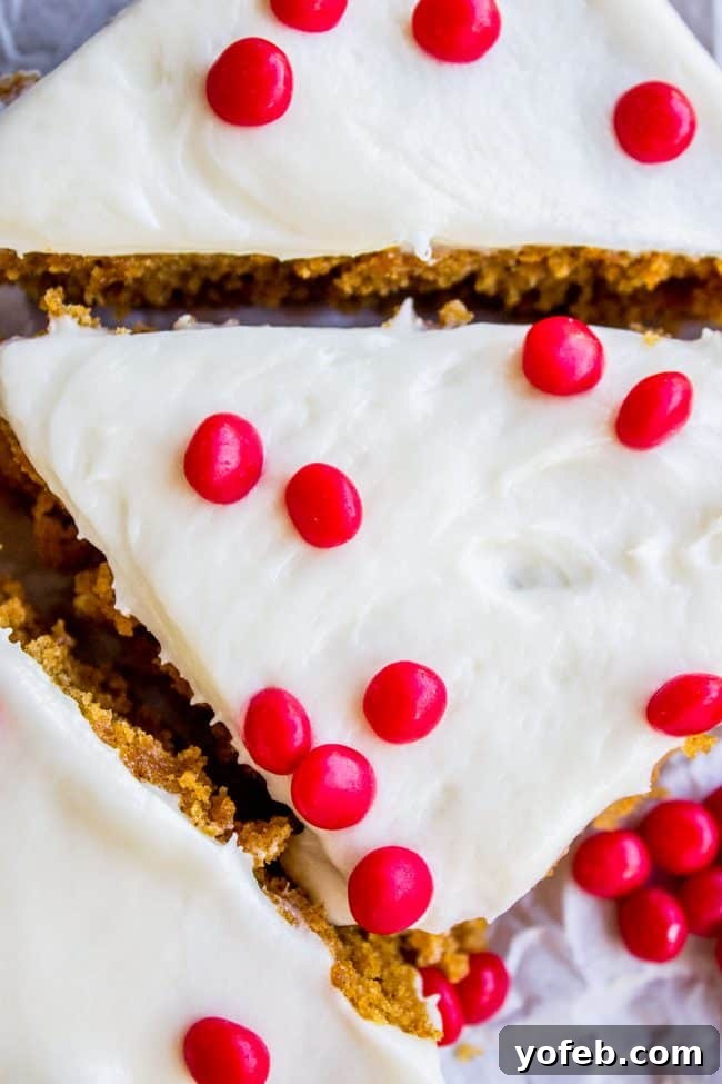 Decadent Pumpkin Squares with Cream Cheese Frosting 7 Two generously frosted pumpkin bars, featuring the unique cinnamon red hots topping.