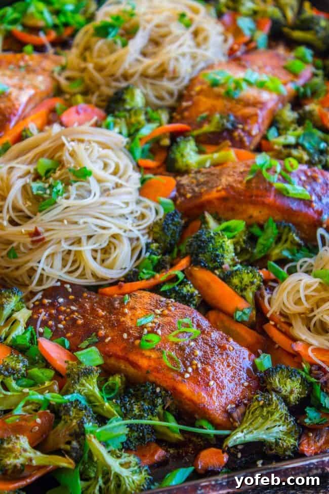 One Pan Asian Sesame Salmon with Noodles and Roasted Veggies 10 Sheet Pan Asian Salmon, Broccoli, Carrots, and Rice Noodles after cooking