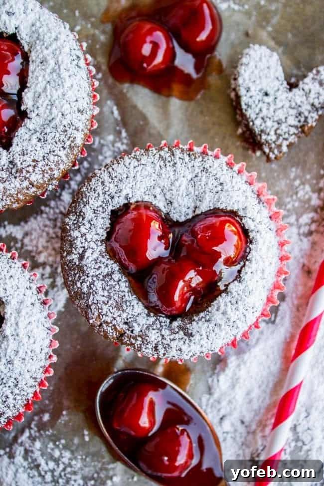 A close-up of the delicate powdered sugar dusting on the Valentine's Day cupcakes.