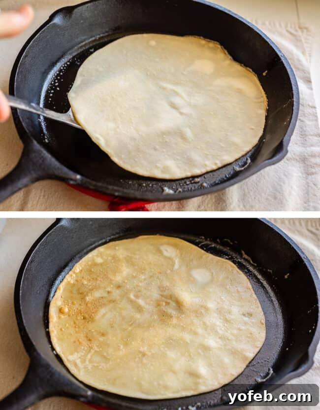 Roti Buttery Indian Flatbread Perfection 20 flipping raw roti bread, the bread flipped on the other side in a cast iron skillet.