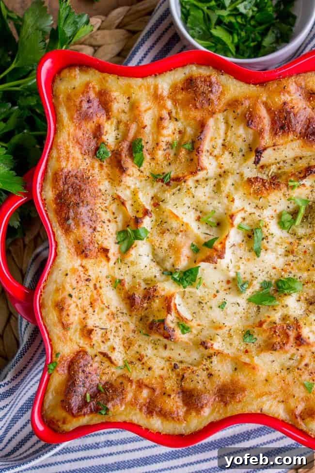 Make Ahead Creamy Italian Mashed Potatoes: Your Ultimate Holiday Side Dish Creamy mashed potatoes baked until crispy and golden brown