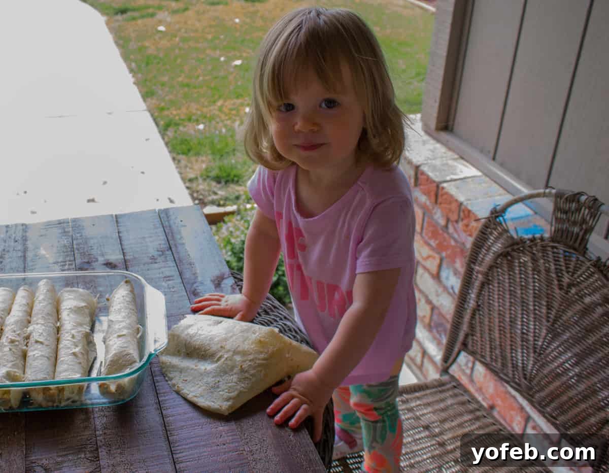 Aunt Shirley's Famous Creamy Chicken Enchiladas 2 girl eating enchiladas