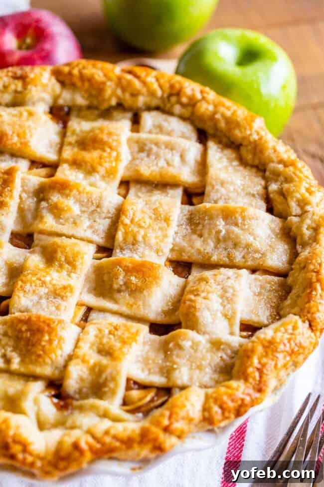 Grandma's Secret Apple Pie 5 A classic apple pie featuring a beautiful lattice crust, baked to golden perfection, ready to be served.