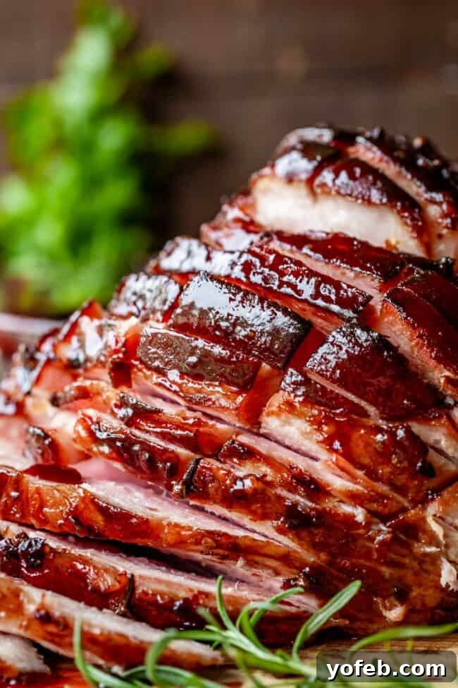Serving Baked Ham for Family Dinner Family gathered around a dining table with the baked ham