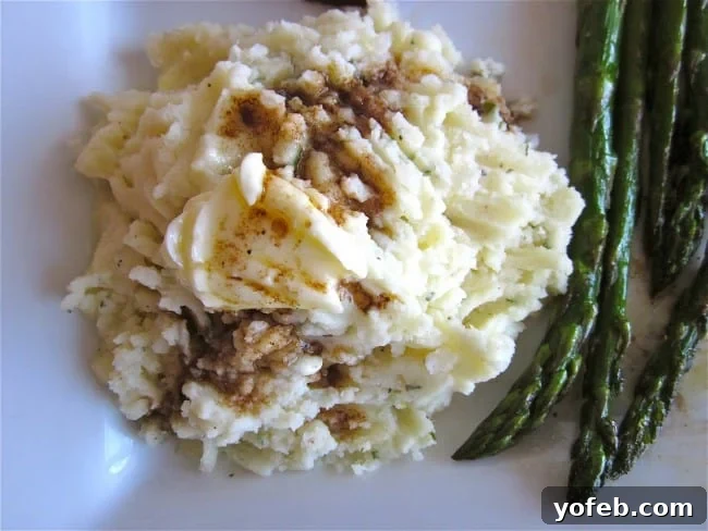 Mashed Potatoes (From Heaven) from TheFoodCharlatan.com - a large serving bowl filled with creamy, rich mashed potatoes.