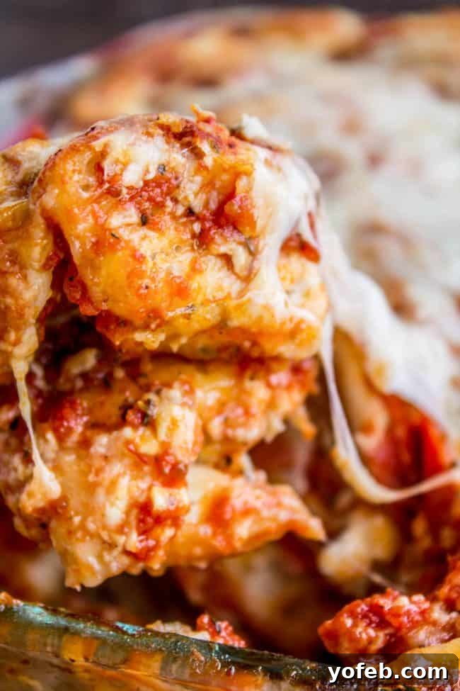 Effortless Pizza Bake 3 Easy Pizza Casserole with melted cheese.