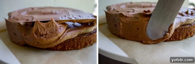 Technique for spreading a generous amount of chocolate frosting on a cake, ensuring every bite is covered. An overhead view demonstrating the technique for spreading smooth, even chocolate frosting onto a cake layer using an offset spatula.