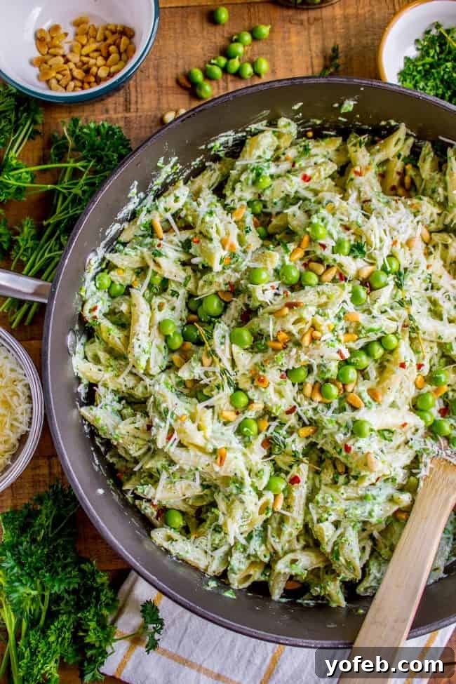 Lemon Ricotta Pasta with Fresh Peas (30 Minutes) from The Food Charlatan. This lemon pasta recipe is perfect for summer! It is so easy and done in 30 minutes. The cheesy sauce is made by blending ricotta with peas and lemon. Top it with Parmesan and garden fresh peas, and you have a hearty vegetarian dinner! It's so good! #pasta #lemonpasta #ricotta #ricottapasta #peas #freshpeas #pinenuts #summer #easy #easyrecipe #30minutes #parmesan #garlic #creamy #sauce #healthy #vegetarian #onepot Creamy ricotta pasta with vibrant green peas and a hint of lemon, a delightful vegetarian dish