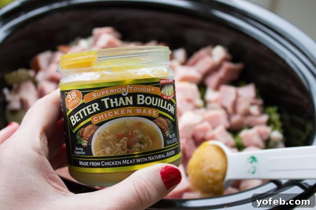 Hearty Split Pea and Ham Soup 5 Measuring Better than Bouillon Chicken Base directly into a slow cooker pot filled with other ingredients for split pea soup.