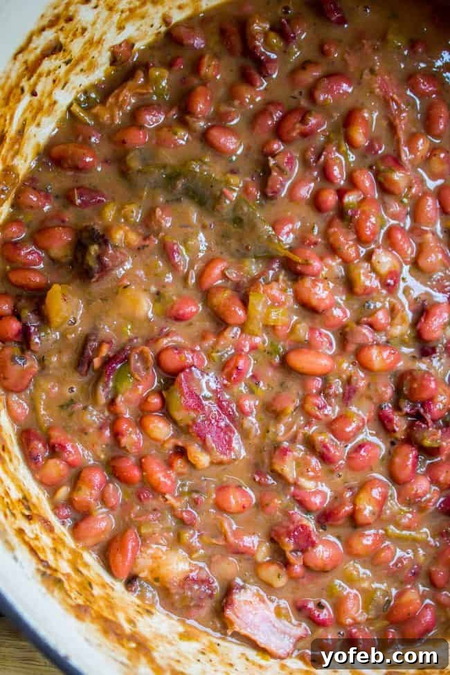 Soulful Cajun Red Beans and Rice 4 A close-up shot of a large pot brimming with perfectly cooked, creamy red beans, ready to be served.
