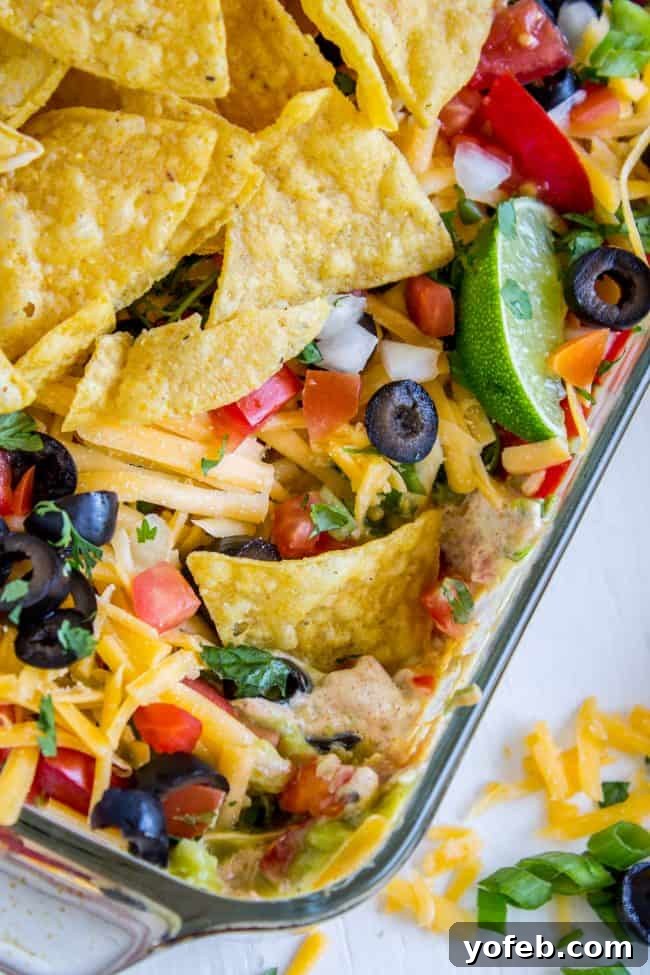 Carols Epic Seven Layer Bean Dip 12 7 layer dip with black olives, tomato and lime.