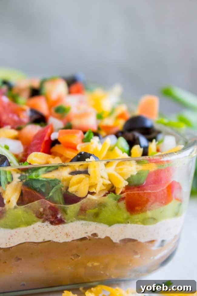 Carols Epic Seven Layer Bean Dip 3 7 layer bean dip shot from the side.