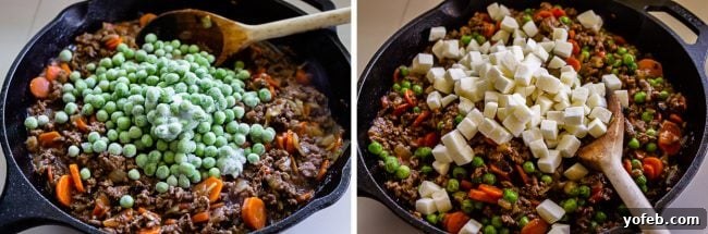 One Skillet Shepherd's Pot Pie from The Food Charlatan. It's like Shepherd's Pie and Chicken Pot Pie got together and had a baby to make a One Skillet Shepherd's Pot Pie! Regular skillet shepherd's pie would feature mashed potatoes, but instead we are covering ours up with a super flaky pie crust, just like it's a pot pie. It's comfort food heaven!! #recipe #easy #best #beef #traditional #skillet #castiron #casserole #withgravy #withcrust #cheddar #onepot #cheese #carrots #peas #flaky #crust shepherds pot pie with golden crust and cheese