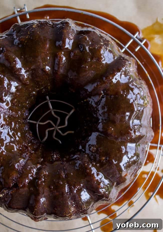 Ginger Sticky Toffee Pudding Cake from The Food Charlatan. This is a classic English dessert! The chopped dates make it incredibly moist as is, but then we go and dump buttery caramel sauce all over the top of it while it's warm. It's ridiculous and you will love it! #cake #pudding #english #englishpudding #toffee #sticky #ginger #recipe #easy #baked #dates #traditional #holidays #thanksgiving #Christmas #fall #fallbaking #spice #spicecake #caramel #caramelsauce Delicious Ginger Sticky Toffee Pudding Cake, a delightful dessert