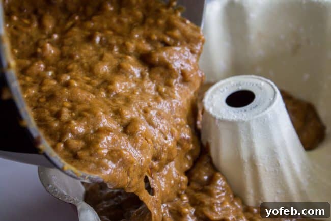 Ginger Sticky Toffee Pudding Cake from The Food Charlatan. This is a classic English dessert! The chopped dates make it incredibly moist as is, but then we go and dump buttery caramel sauce all over the top of it while it's warm. It's ridiculous and you will love it! #cake #pudding #english #englishpudding #toffee #sticky #ginger #recipe #easy #baked #dates #traditional #holidays #thanksgiving #Christmas #fall #fallbaking #spice #spicecake #caramel #caramelsauce Thick batter for sticky toffee pudding cake