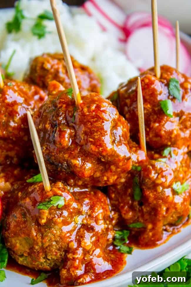 Delicious Easy Baked Mexican Meatballs with Roasted Poblanos Easy Baked Mexican Meatballs served with a rich enchilada sauce.