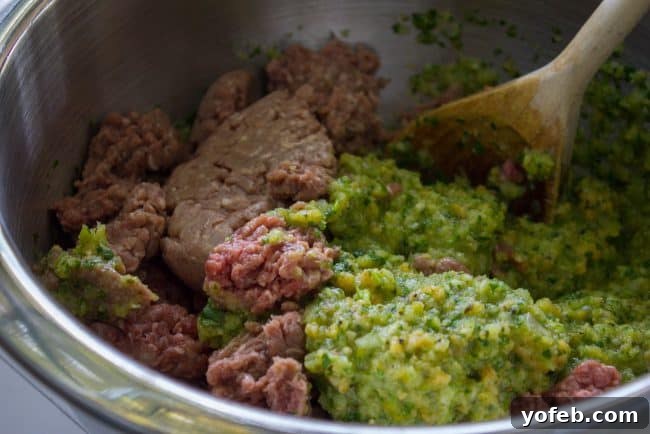 Combining All the Flavorful Meatball Ingredients Mixing the meatball ingredients in a large bowl.