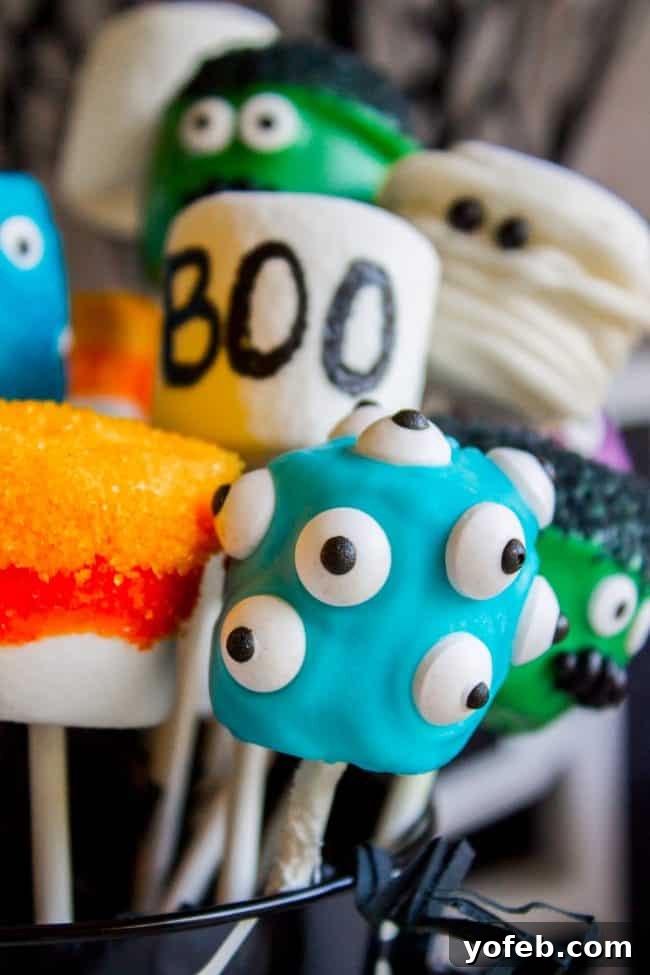 Detailed Mummy Marshmallow Pop: A spooky and sweet Halloween design. A spooky yet sweet Mummy marshmallow pop, featuring white icing bandages wrapped around a marshmallow on a stick, with two small black nonpareils serving as eyes.