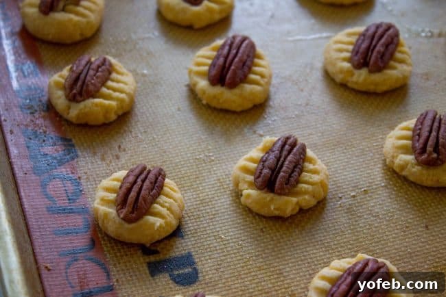 Holiday Southern Pecan Cheese Wafers 9 Close-up of baked Southern Pecan Cheese Wafers on a wire rack, cooling down.