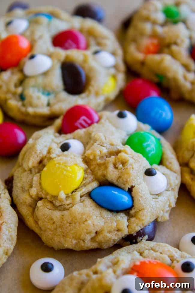Monster Cookies with candy eyes Close-up of monster cookies adorned with candy eyes and colorful M&Ms.