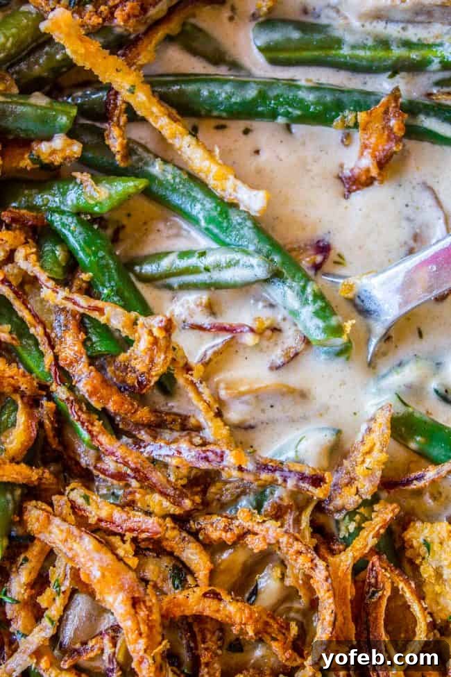 The Best Homemade Green Bean Casserole with Fresh Ingredients and Crispy Onions for Thanksgiving Homemade Green Bean Casserole with golden crispy fried onions on top.