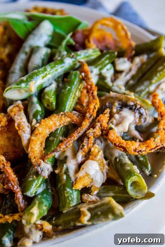 The ultimate Thanksgiving Homemade Green Bean Casserole Green Bean Casserole with creamy homemade sauce and crunchy fried onions.