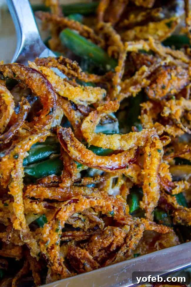 Elevate Your Holiday Table with Homemade Green Bean Casserole A generous serving of Homemade Green Bean Casserole with its golden, crunchy topping.