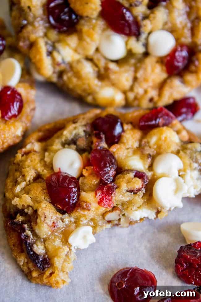 Cranberry White Chocolate Chip Cookies: The ultimate holiday treat, combining sweet white chocolate with tart cranberries, delivering a satisfying chew and crisp edges. Beautifully baked Cranberry White Chocolate Chip Cookies on a cooling rack, ready for holiday enjoyment