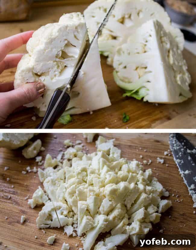 Removing the core from a cauliflower and cutting it into smaller florets on a wooden cutting board.