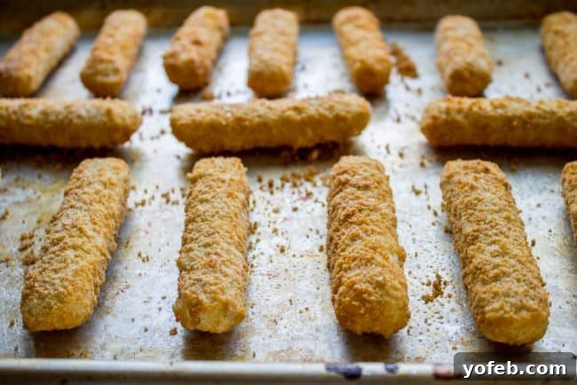 Crispy Fish Thai Peanut Lettuce Wraps 2 fish sticks on a baking sheet.