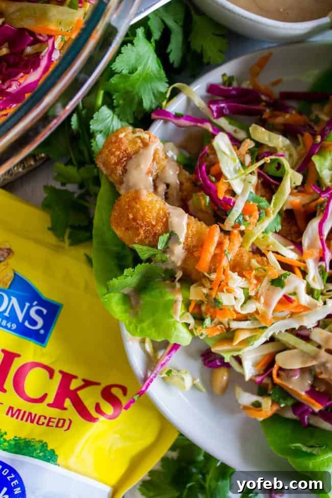 Crispy Fish Thai Peanut Lettuce Wraps 3 Thai lettuce wrap on a plate.
