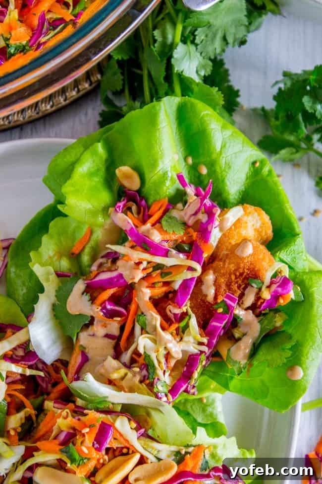 The perfect peanut sauce topping for healthy fish lettuce wraps. peanut sauce drizzled on top of a fish taco.