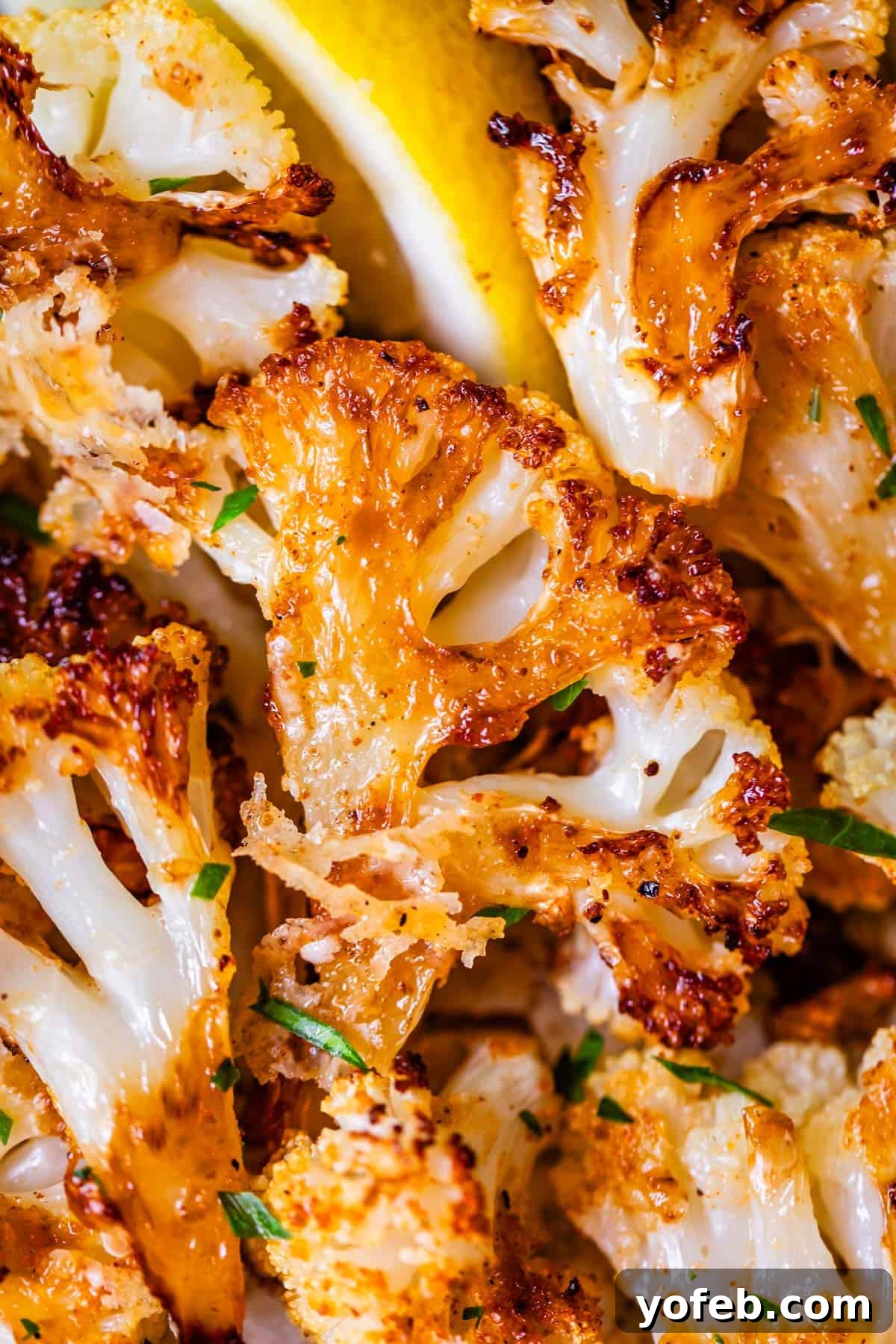 Perfectly Golden and Crispy Roasted Cauliflower 21 perfectly golden brown and crispy roasted cauliflower with parsley garnish.