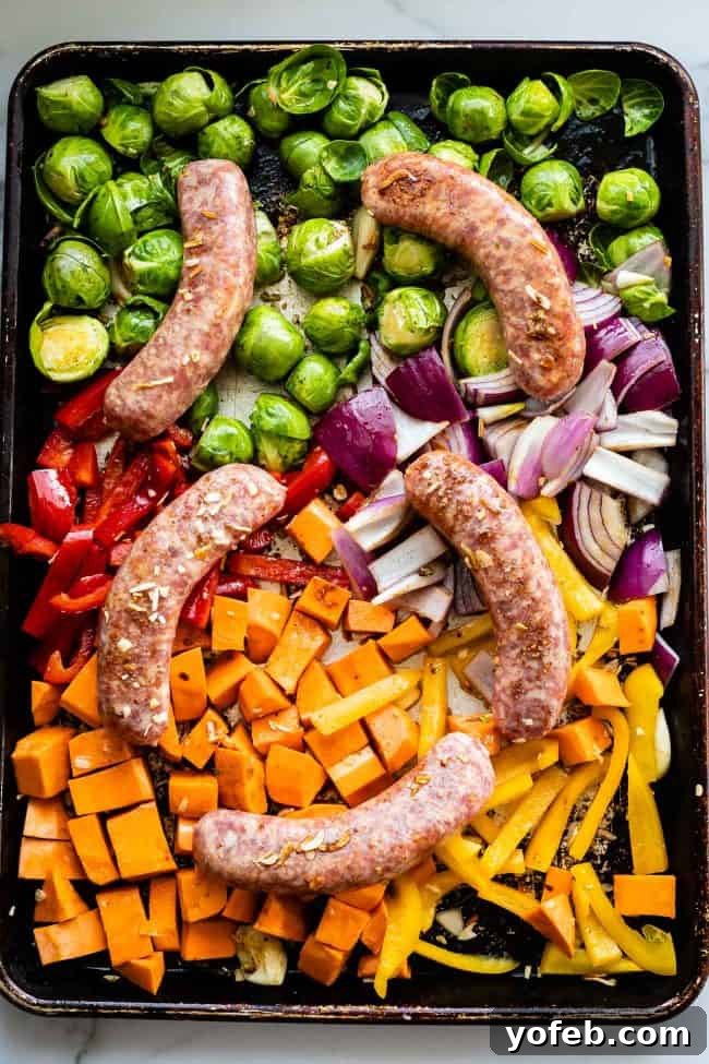 Roasted Sausage on a Sheet Pan Close-up of roasted sausage links on a baking sheet, golden brown and perfectly cooked.