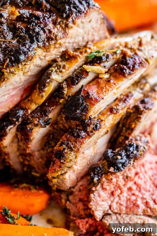 Delicious Sliced Roast Lamb with Carrots Side Dish Succulent slices of roast lamb arranged on a plate with tender cooked carrots, highlighting the golden crust and juicy meat.