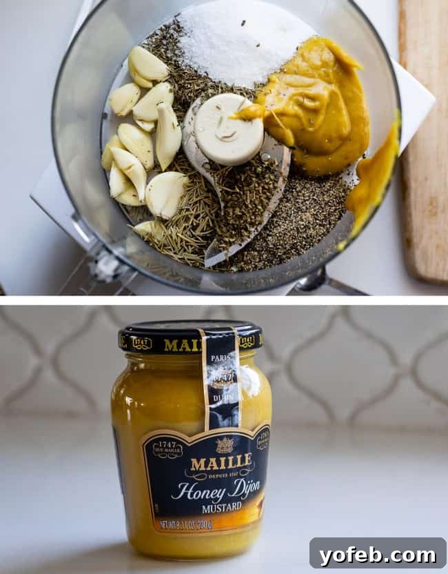 Garlic and Honey Dijon Rub for Lamb A food processor bowl filled with a vibrant mixture of garlic, thyme, and honey Dijon mustard, with a jar of mustard in the background.