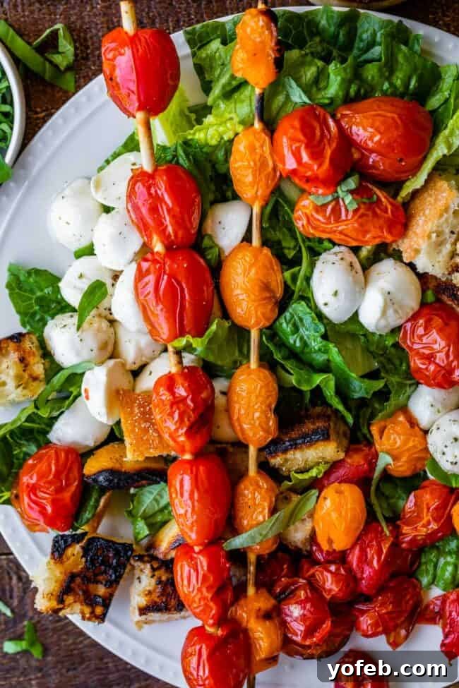 Grilled Tomato, Basil & Mozzarella Salad: The Ultimate Summer Caprese with a Smoky Twist Grilled Tomato, Basil & Mozzarella Salad (Caprese) with toasted ciabatta and fresh greens